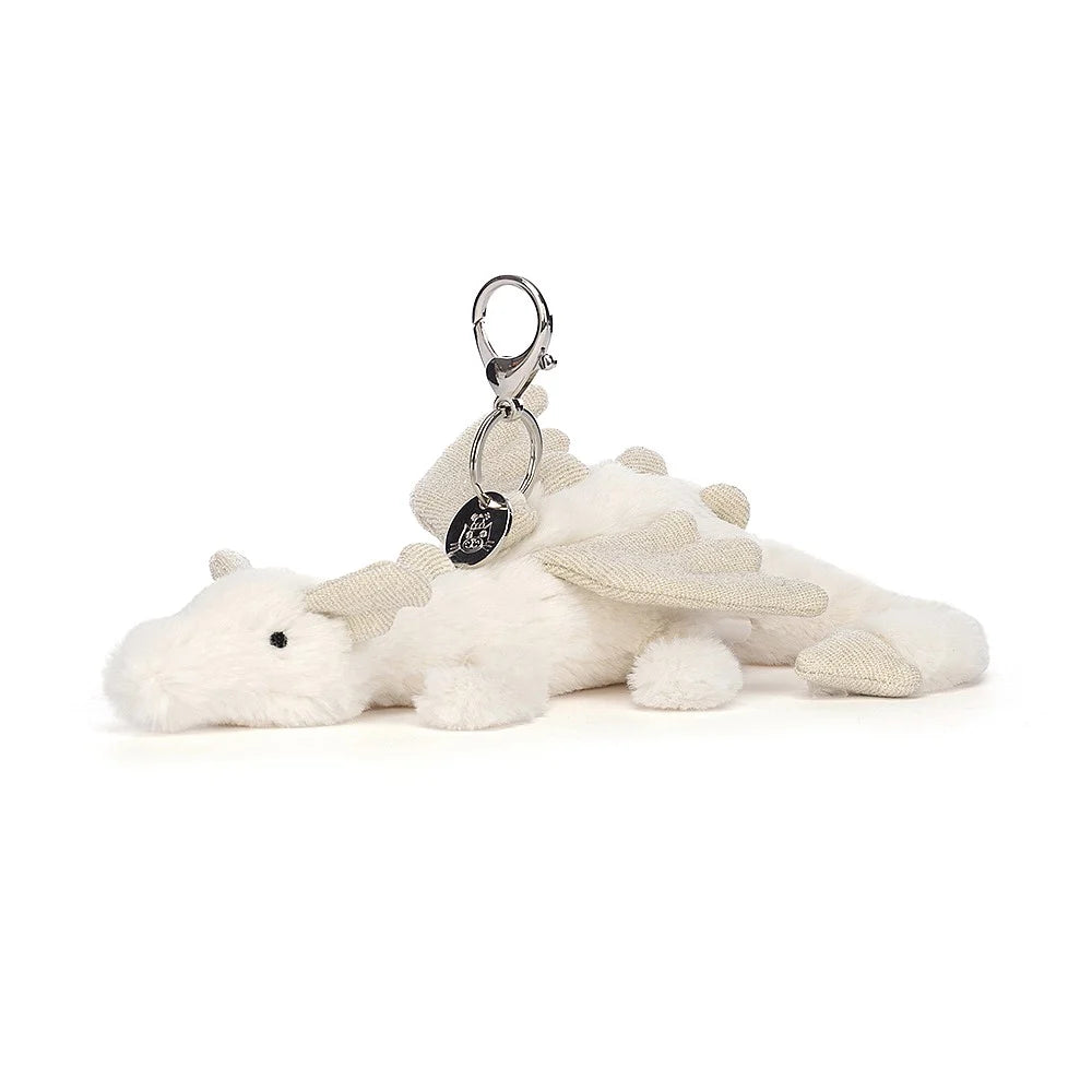 Soft and charming Jellycat designsJELLYCAT SNOW DRAGON BAG CHARM CREAM & GLITTER 12X8X22 CM